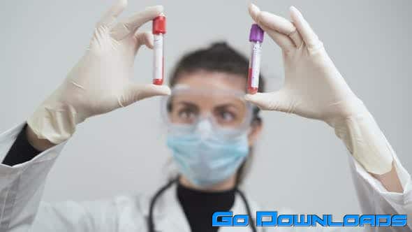 Doctor Comparing Blood Samples From Corona Positive Patients at Laboratory (Stock Footage) Free Download